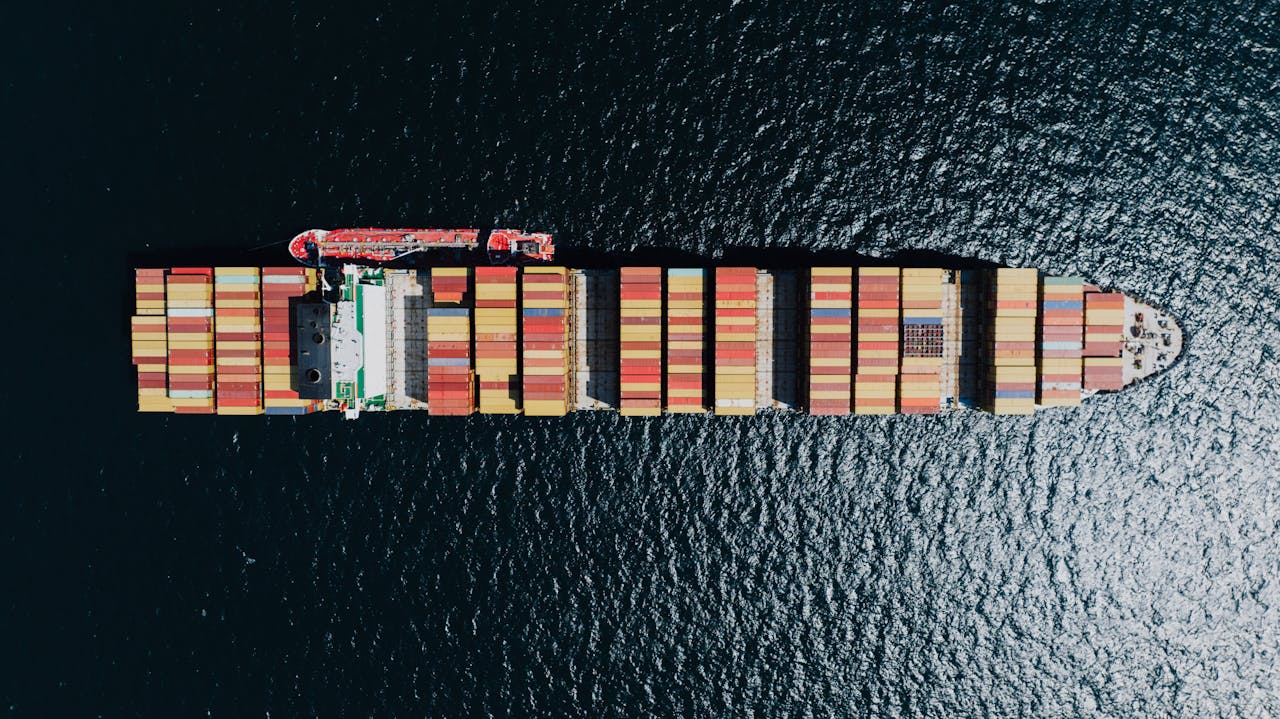 Aerial view of a large container ship sailing near Naples, Italy.